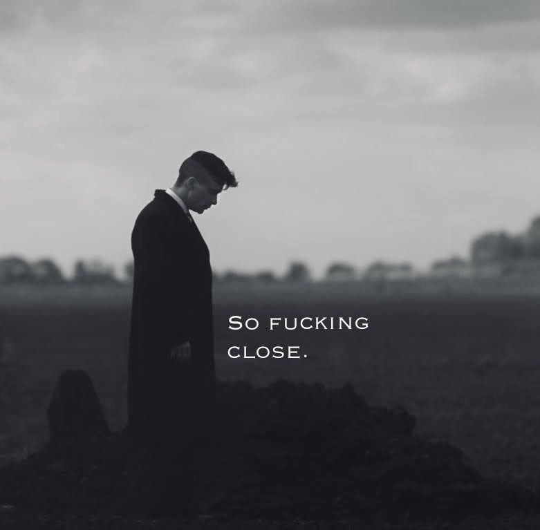 Person in dark coat, contemplative mood.
