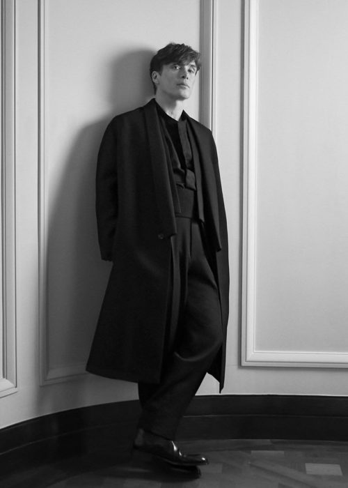 Stylish figure in elegant black attire.