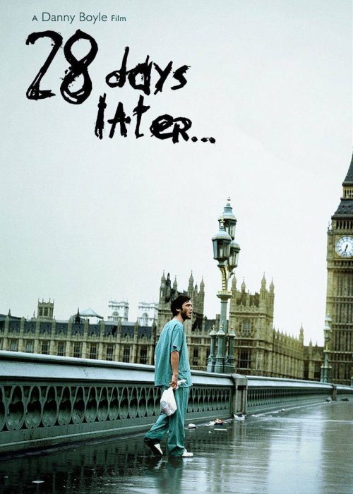 Lonely figure on rainy city street.